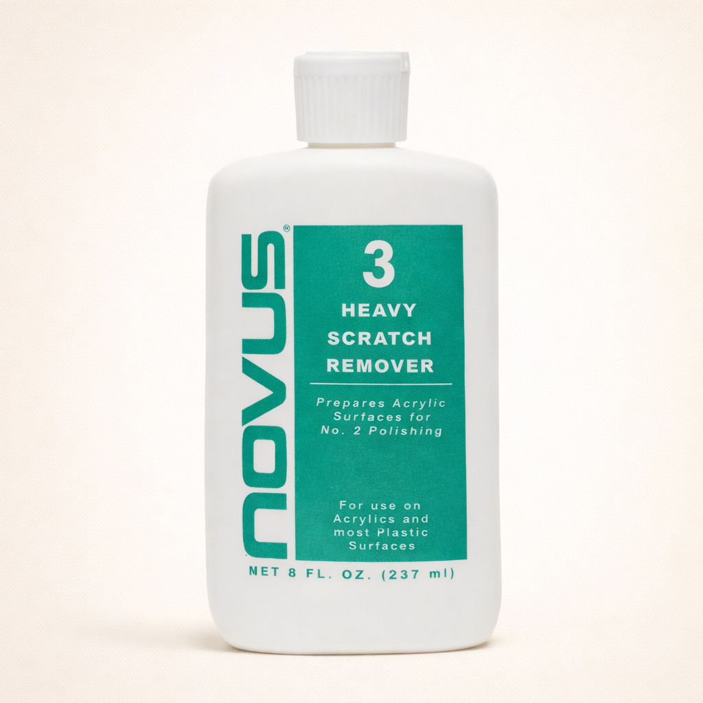 Novus Heavy Scratch Remover bottle on a beige background