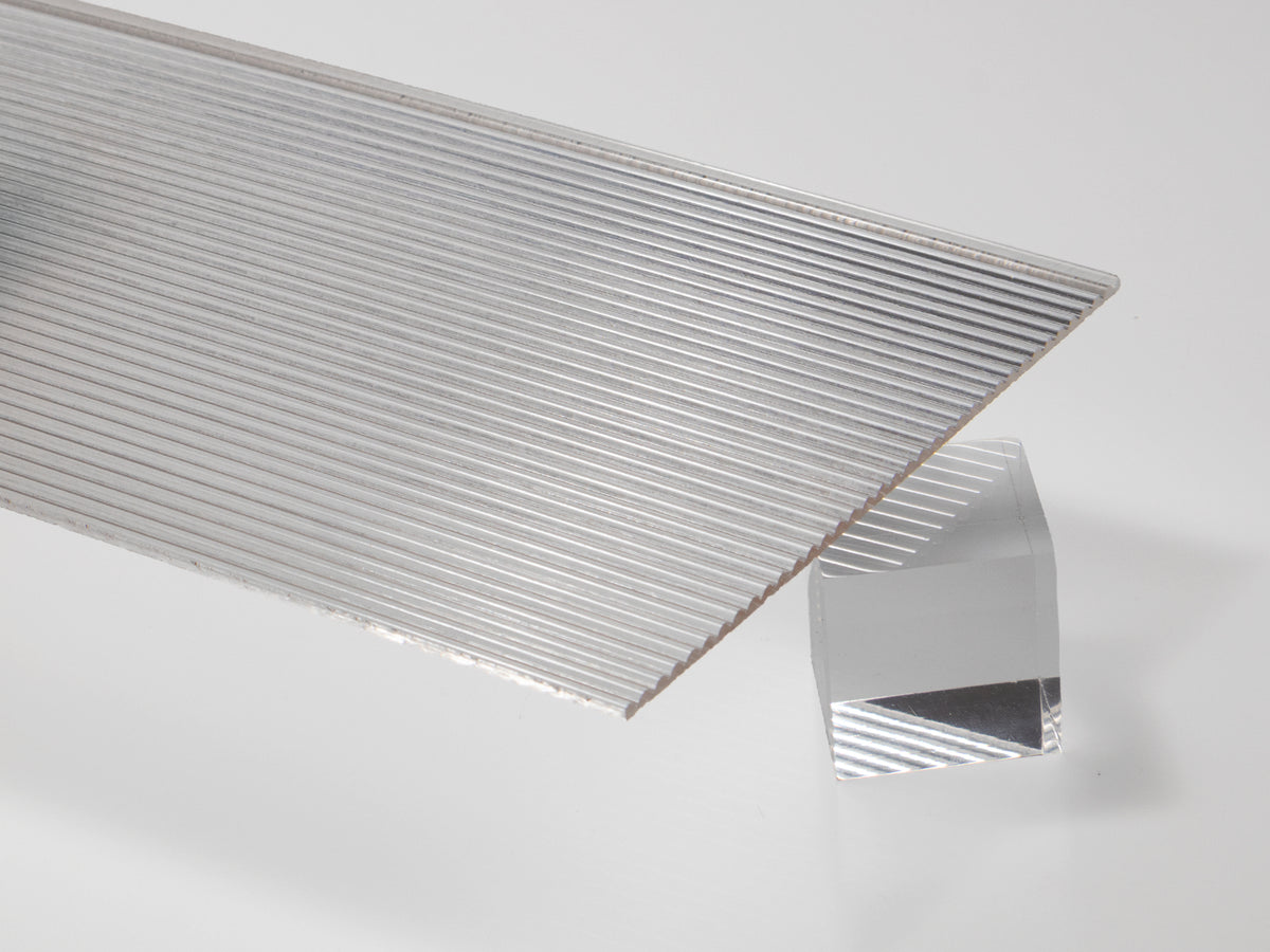 Clear fluted acrylic sheet, vertical ribbed face with a flat glossy back