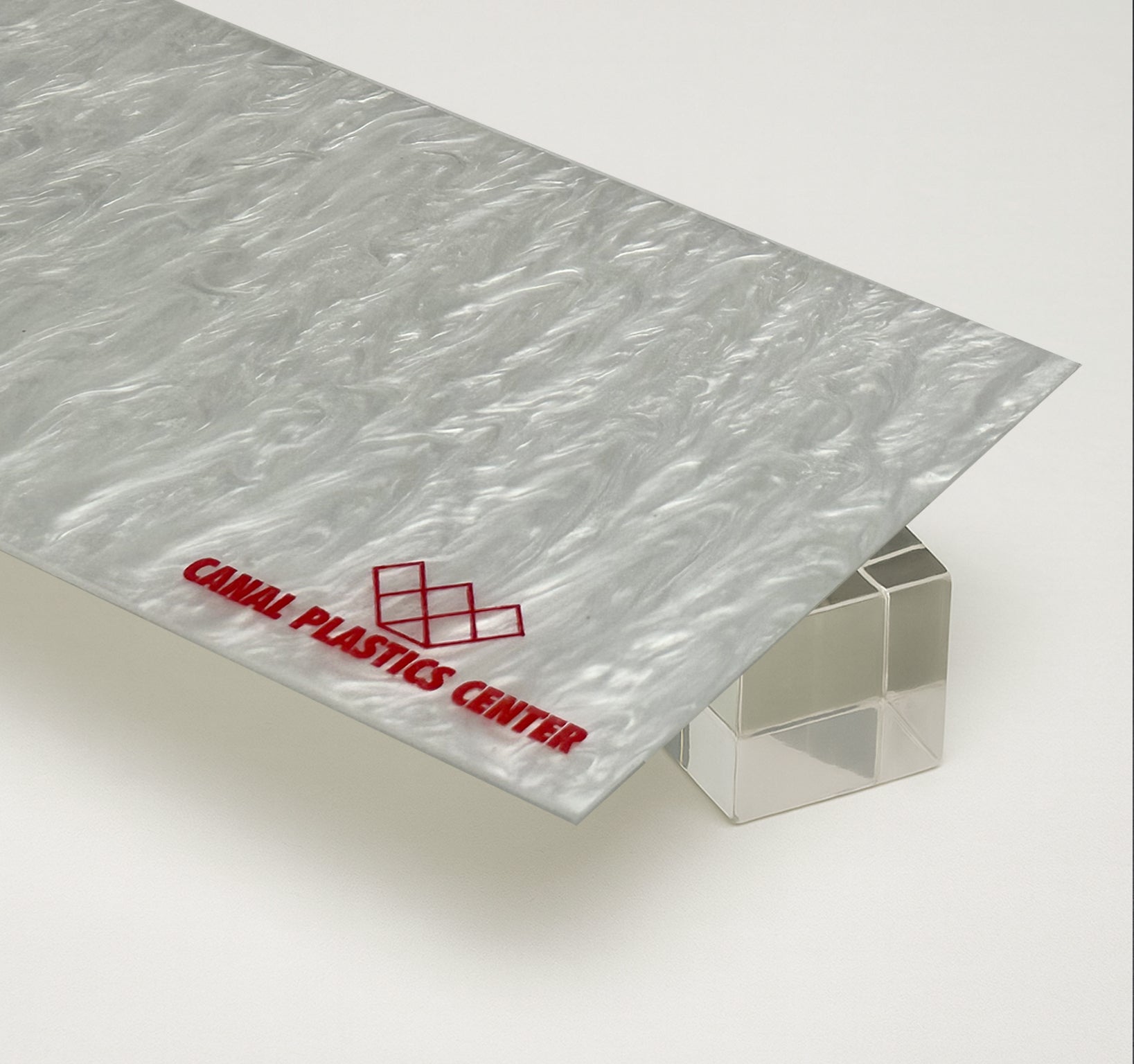 Canal Plastics Center's Arctic White Pearl acrylic glows with a crisp, icy elegance, blending cool white tones with a subtle pearlescent shimmer. Its sleek surface and luminous depth evoke the purity of fresh snow and the sophistication of polished stone, making it a stunning choice for modern designs that call for both clarity and character.