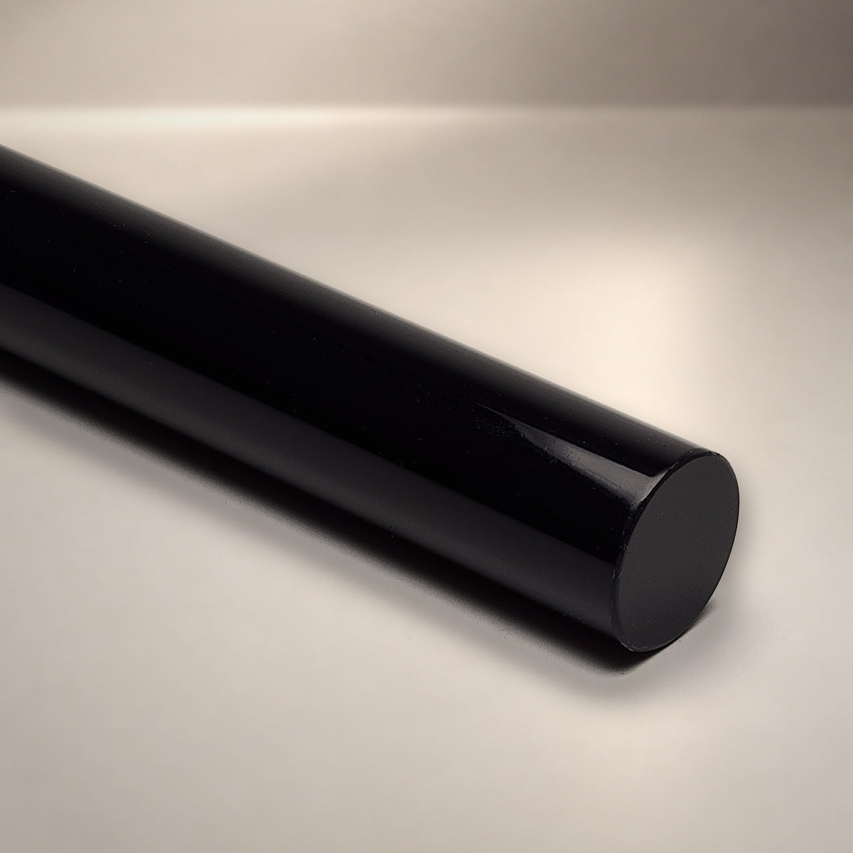 Black opaque acrylic round rod - Canal Plastics Center