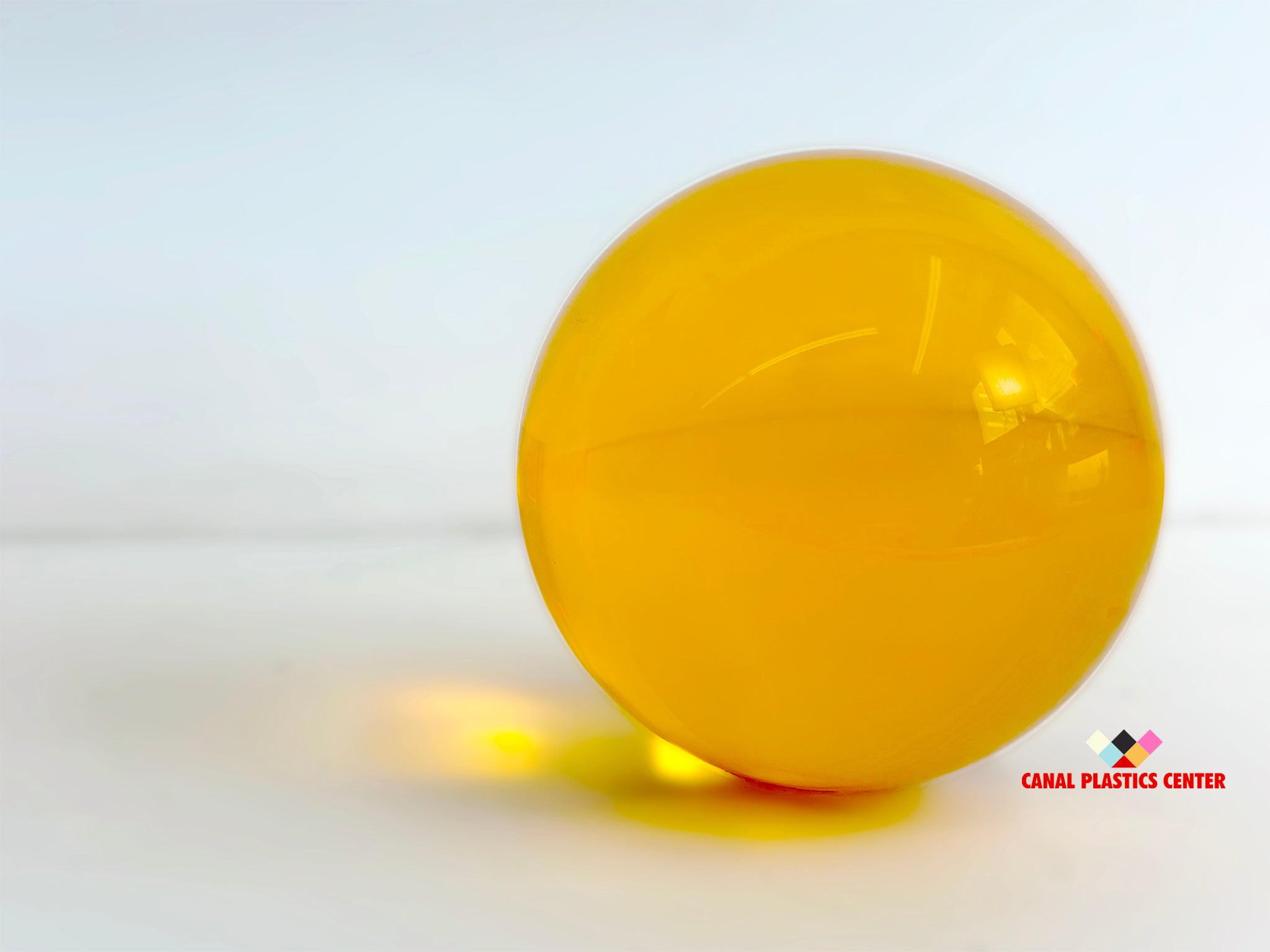 Canal Plastics Center Amber Orange Transparent Acrylic Sphere, wide view, bright background - for decorative and artistic uses to scientific and industrial purposes such as displays and visual merchandising, art installations and sculptures, photography props and effects, home decor, costume and prop making, optical applications, model making and prototyping, furniture accessories and more