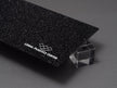 Canal Plastics Center Black Glitter Acrylic Plexiglass Sheet, Top View - Urban Spark Collection for crafts, signage, displays, and even furniture accents