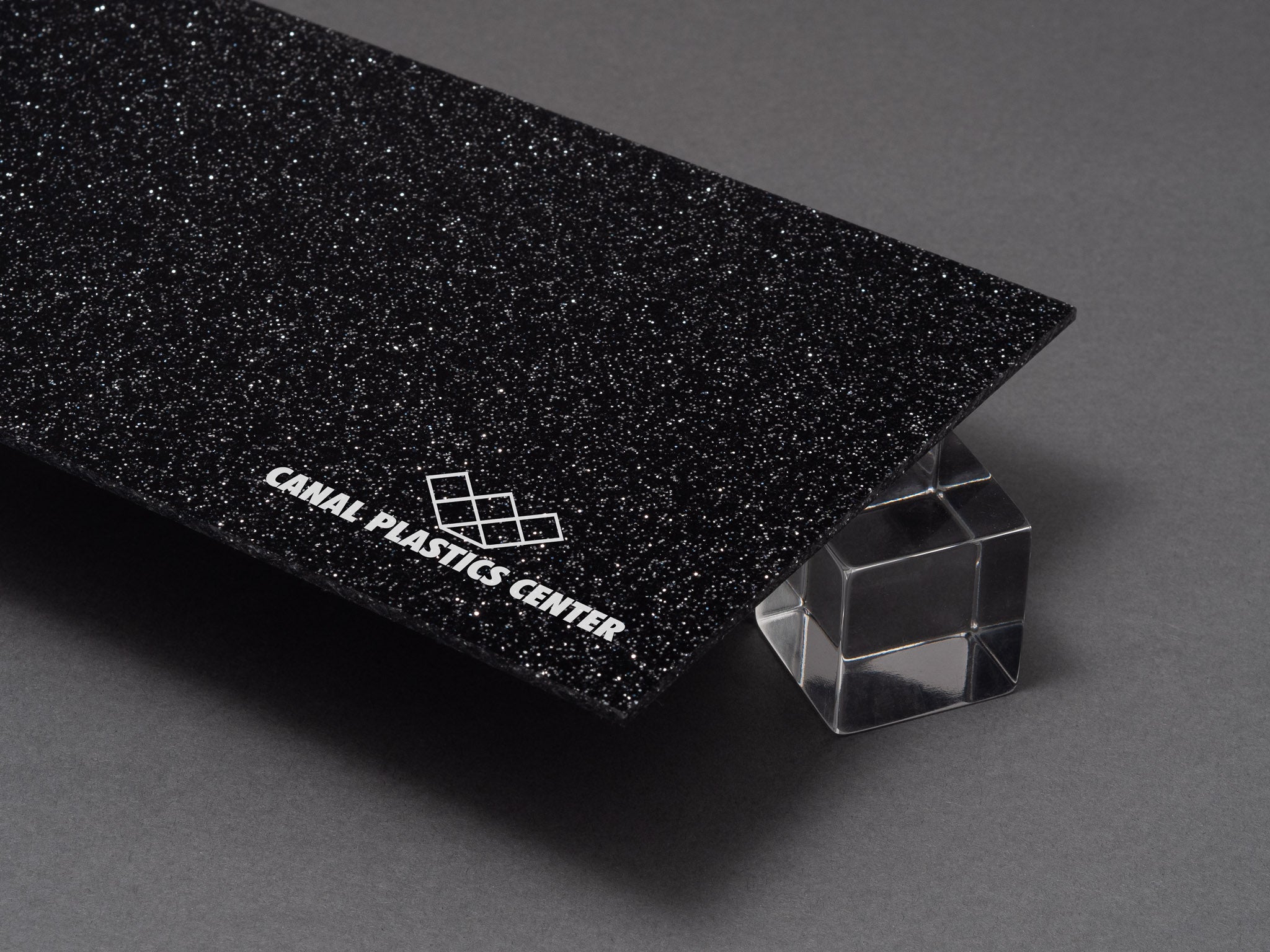 Canal Plastics Center Black Glitter Acrylic Plexiglass Sheet, Top View - Urban Spark Collection for crafts, signage, displays, and even furniture accents