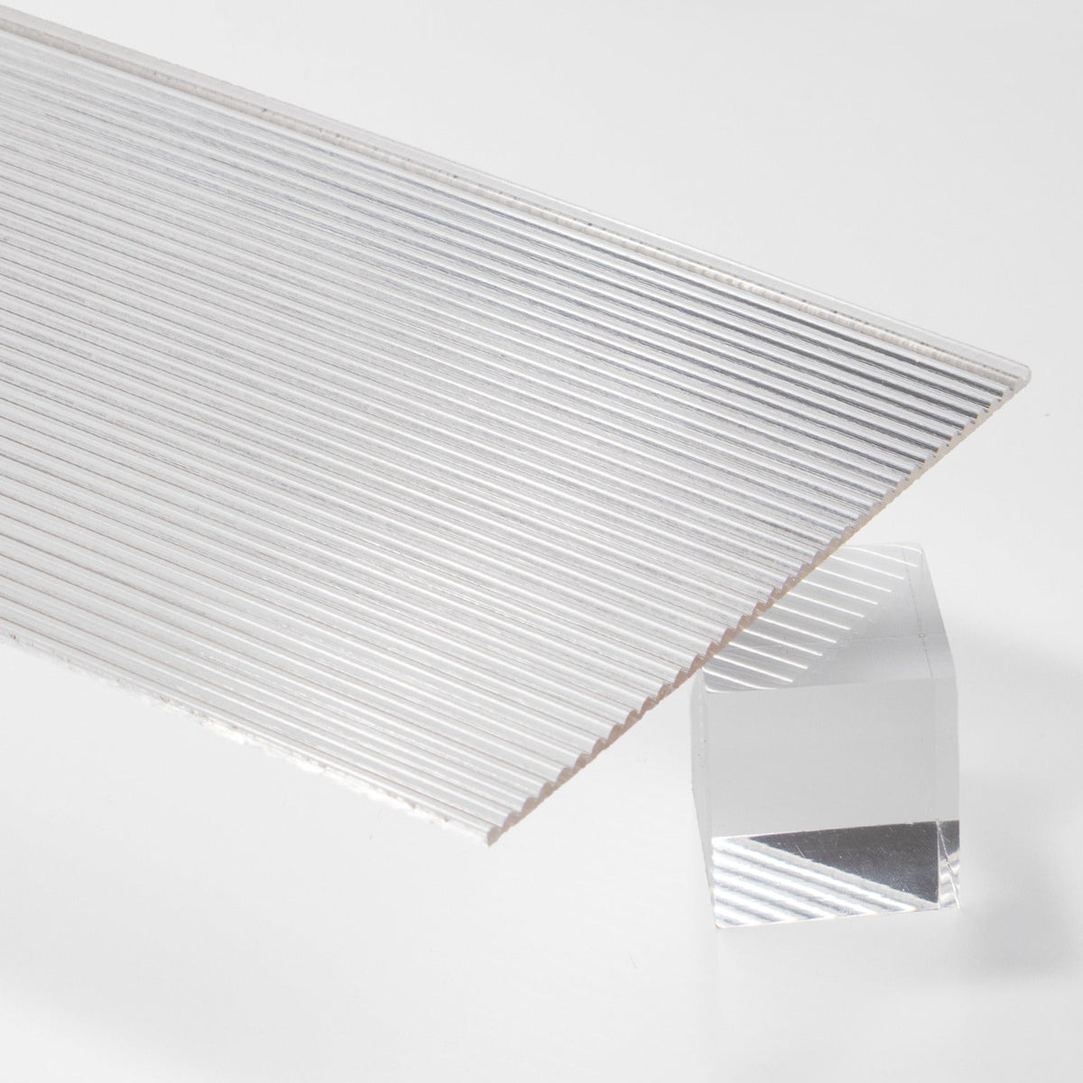 Clear Fluted Acrylic Plexiglass Sheet with Vertical Ribbed Face and Flat Glossy Back, Top view - Canal Plastics Center
