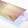 Iridescent Fluted Acrylic Plexiglass Sheet, ribbed face with a color shifting film on the flat back, Top view - Canal Plastics Center