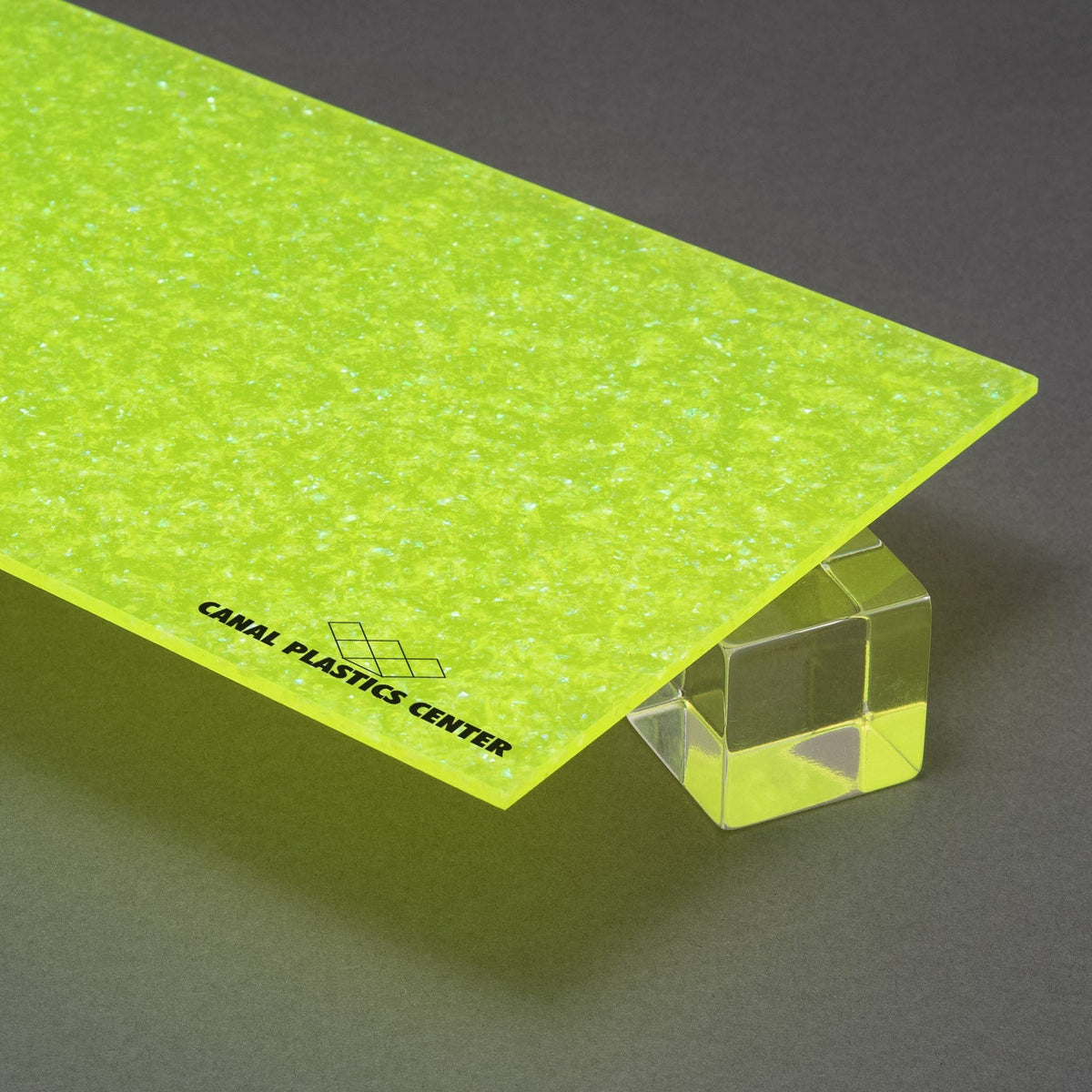 Canal Plastics Center's Green Neon Glitter acrylic, part of the Urban Spark Collection, electrifies any design with its bold, vivid, high-voltage hue and sparkling finish. Its durable acrylic base ensures lasting brilliance, while the glitter adds a dynamic pop that turns ordinary into unforgettable.