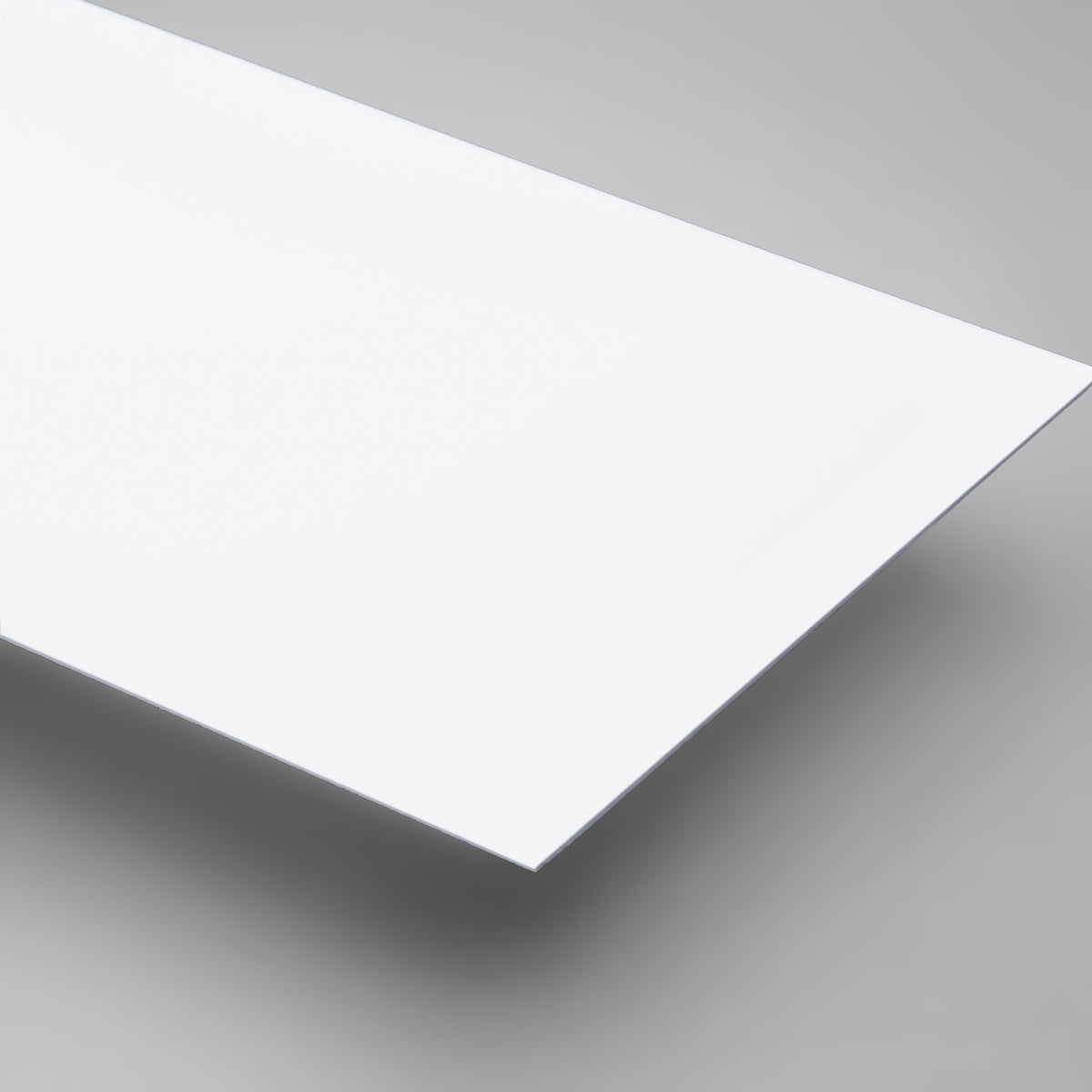 White Matte HIPS styrene sheets on off-white background – lightweight printable plastic - Canal Plastics Center