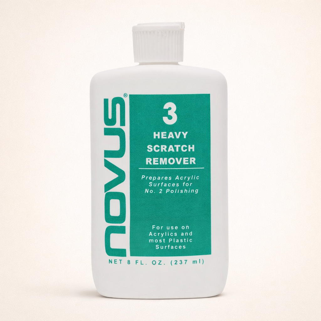 Novus Heavy Scratch Remover bottle on a beige background