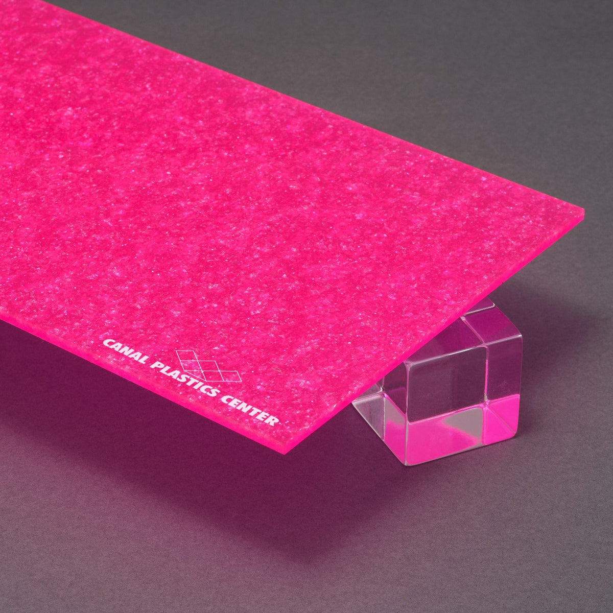 Canal Plastics Center's Pink Neon Glitter acrylic, part of the Urban Spark Collection, electrifies any design with its bold, vivid, high-voltage hue and sparkling finish. Its durable acrylic base ensures lasting brilliance, while the glitter adds a dynamic pop that turns ordinary into unforgettable.